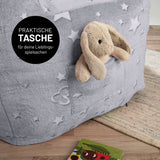 LUMALAND Sessel „Glow in the Dark“ - Kids Size - Sternen-Design mit praktischer Seitentasche und softem, waschbarem Bezug in Grau.