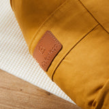 #DoYourYoga Yoga-Kissen Ganesh in Indischgelb, gefüllt mit Bio-Dinkelspelz, halbmondförmig 45x30x14 cm, Baumwollebezug abnehmbar.