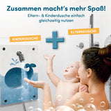 Kinderdusche Wal mit kindgerechtem Wal-Motiv für spielerisches Duschen neben der Erwachsenendusche in weißem Bad.