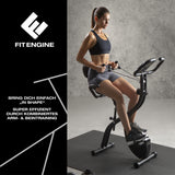 FitEngine Heimtrainer mit Expanderbändern - schwarz, Frau trainiert mit verstellbarem Sattel und großem Display für Herz-Kreislauf-Training.