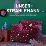 LUMALAND Sessel „Glow in the Dark“ - Kids Size - Sternen-Design - Bezug soft & waschbar - Pink mit leuchtendem Sternenmuster im Kinderzimmer.