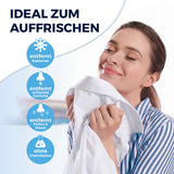 CLEANmaxx Hemdenbügler PRO STEAM + Hosenaufsatz zeigt Frau, die frisch duftendes Hemd zum Auffrischen genießt.