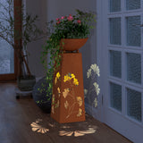 Hoberg LED Pflanzsäule in Rost-Optik mit Gingkoblätter-Design, LED-Beleuchtung und abnehmbarer Pflanzschale, innen platziert.