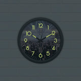 W:O:A Wanduhr "Glow in the dark" mit Logo, nachleuchtende Ziffern und Zeiger, Motiv Wacken, Ø 34 cm, batteriebetrieben.