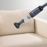 MAXXMEE Akku-Handstaubsauger anthrazit mit starker Saugkraft und Bürstendüse, ideal für Möbel und schwer zugängliche Stellen.