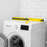 FLÜWA Wasserwaage - 60 cm + 80 cm schwarz/gelb mit ausklappbarem Flügel und magnetischer Unterseite auf Waschmaschine.