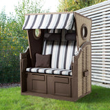 Hoberg 2-Sitzer-Strandkorb mit Bullaugen aus robustem Hartholz und PE-Geflecht, verstellbar mit Nackenrollen und Fußstützen.