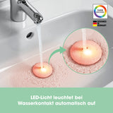 EASYmaxx LED-Abflussstopfen Waschbecken transparent/schwarz mit automatischem Farbwechsel bei Wasserkontakt im Waschbecken.