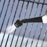 CLEANmaxx Dampfbesen - 5in1 - limegreen/weiß bei der Reinigung eines Grillrosts mit Dampfstrahl und Bürstenaufsatz.