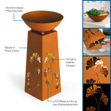 Hoberg LED Pflanzsäule in Rost-Optik mit abnehmbarer Pflanzschale, Gingkoblätter-Design und batteriebetriebener LED-Beleuchtung.