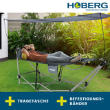 Hoberg klappbare Hängematte mit Sonnendach, tragbar, robust, mit Tragetasche und Befestigungsbändern im Garten aufgebaut.